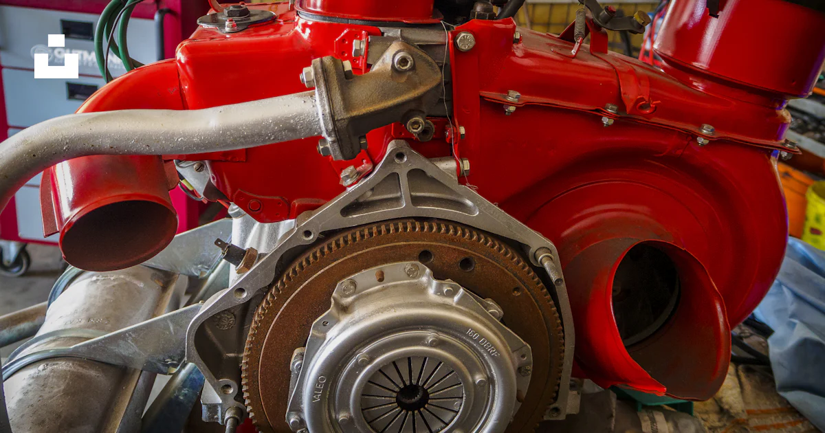 A close up of a red engine in a garage photo – Free Solingen Image on ...