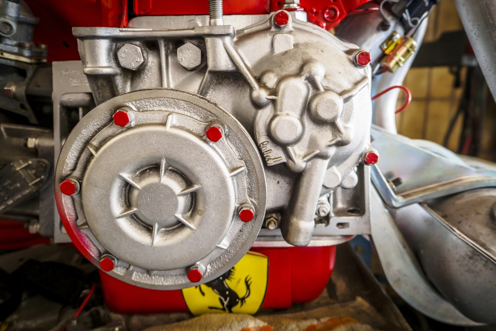 a close up of a red and silver engine