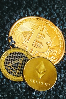 a bitcoin sitting on top of a pile of coins