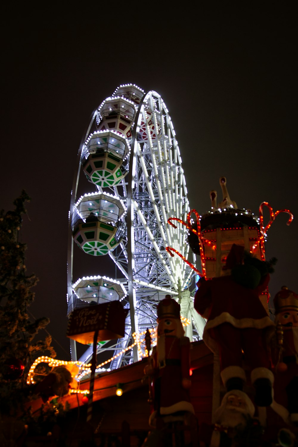 a large ferris wheel lit up at night