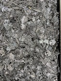 A selection of intricate charms arranged on a wooden table.