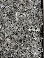 A close-up of a mystery scoop filled with various charms.