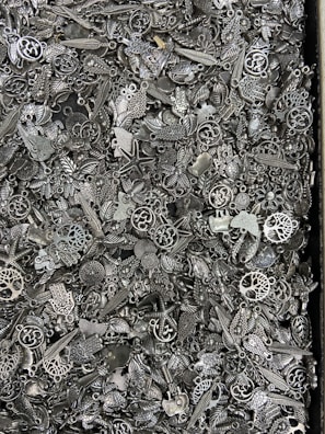 A close-up of a mystery scoop filled with various charms.