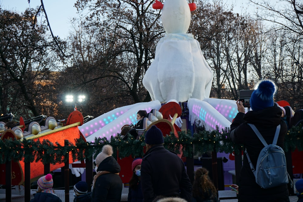 a group of people standing in front of a float