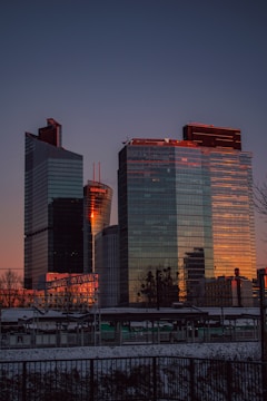 a couple of tall buildings sitting next to each other