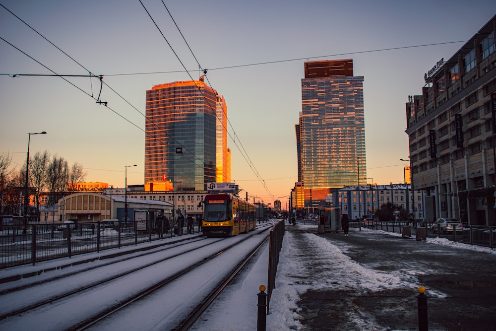 a train on a train track in a city