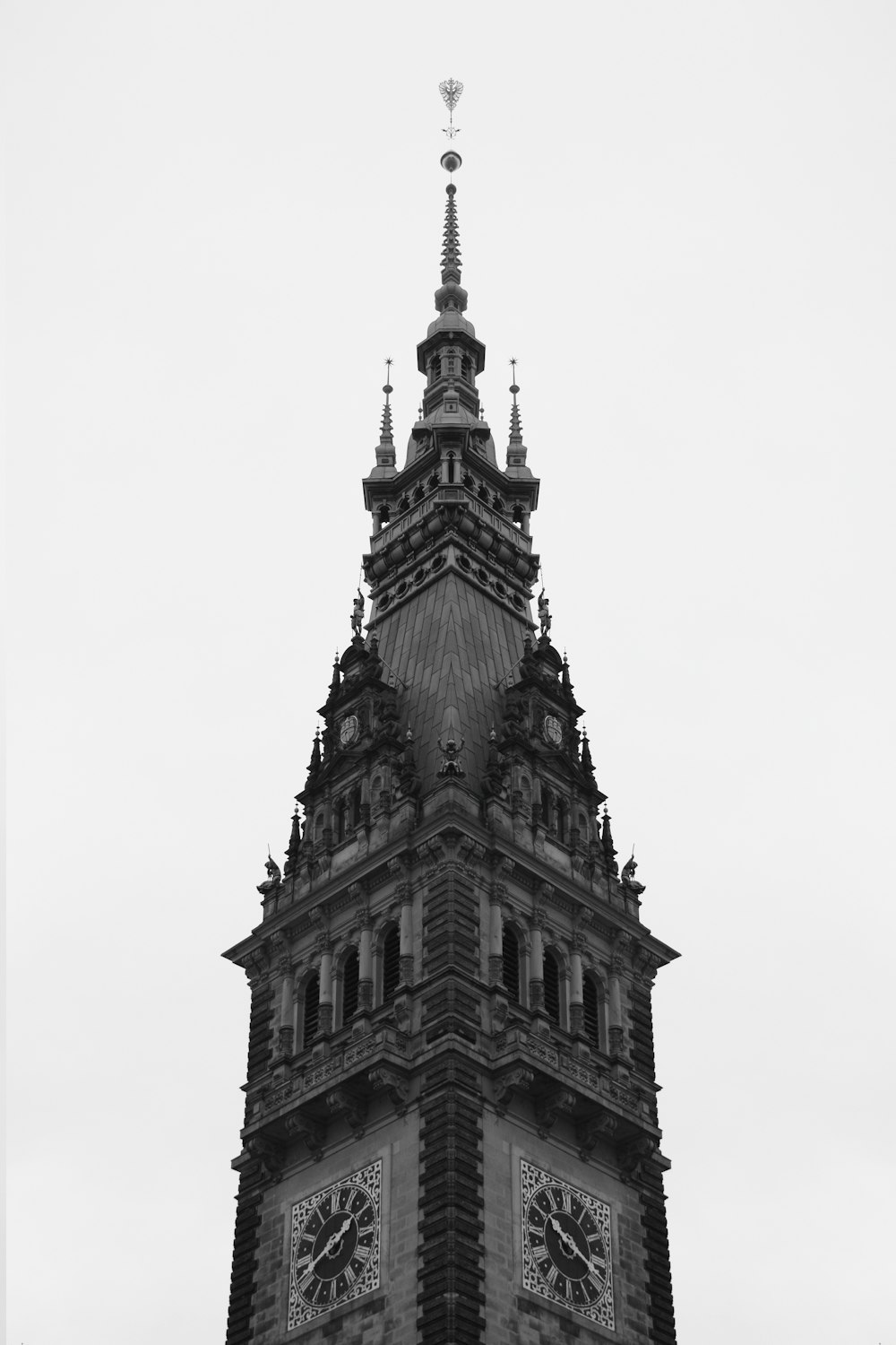 a black and white photo of a clock tower