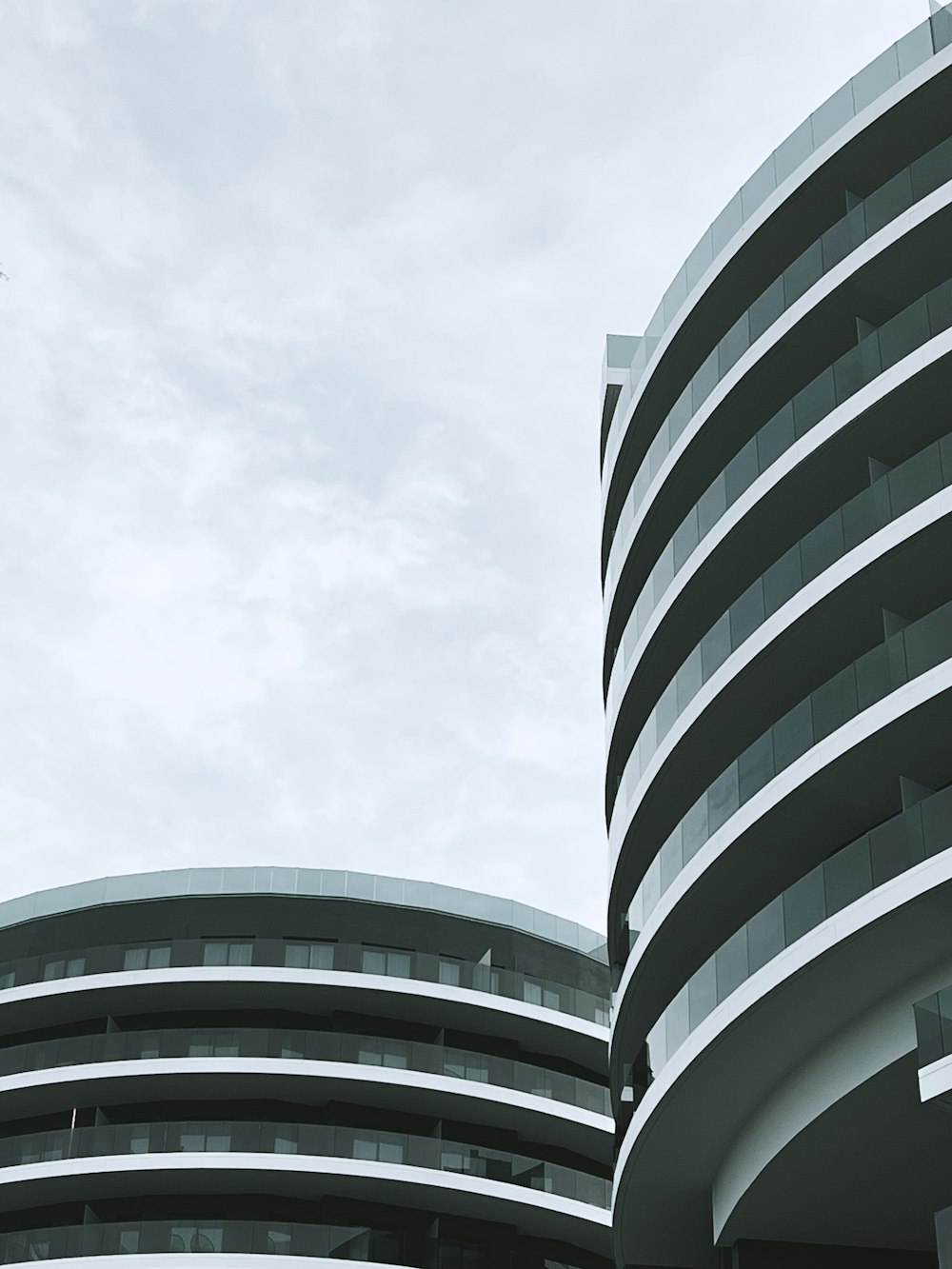 an airplane flying in the sky over a building