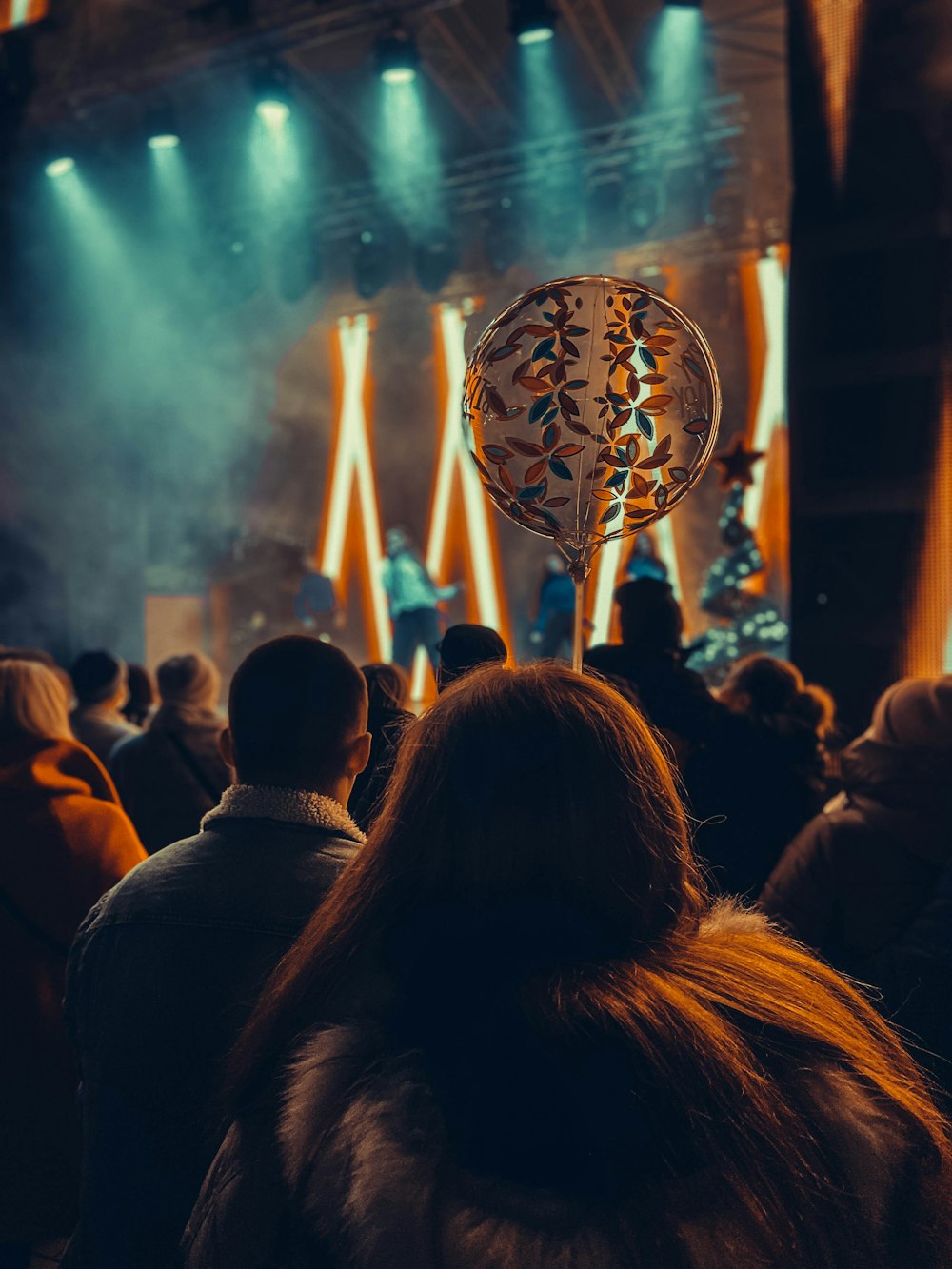 a group of people standing in front of a stage