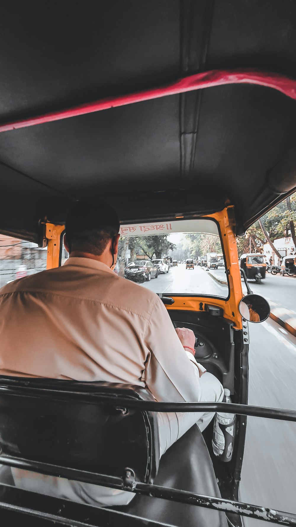 a man driving a truck down a street