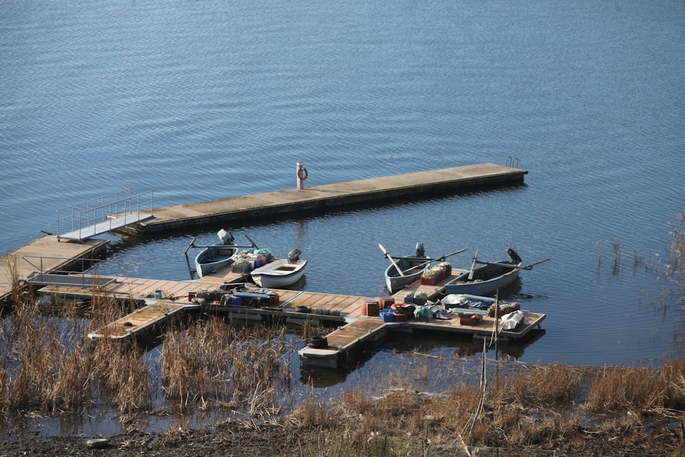 a group of boats sitting on top of a body of water