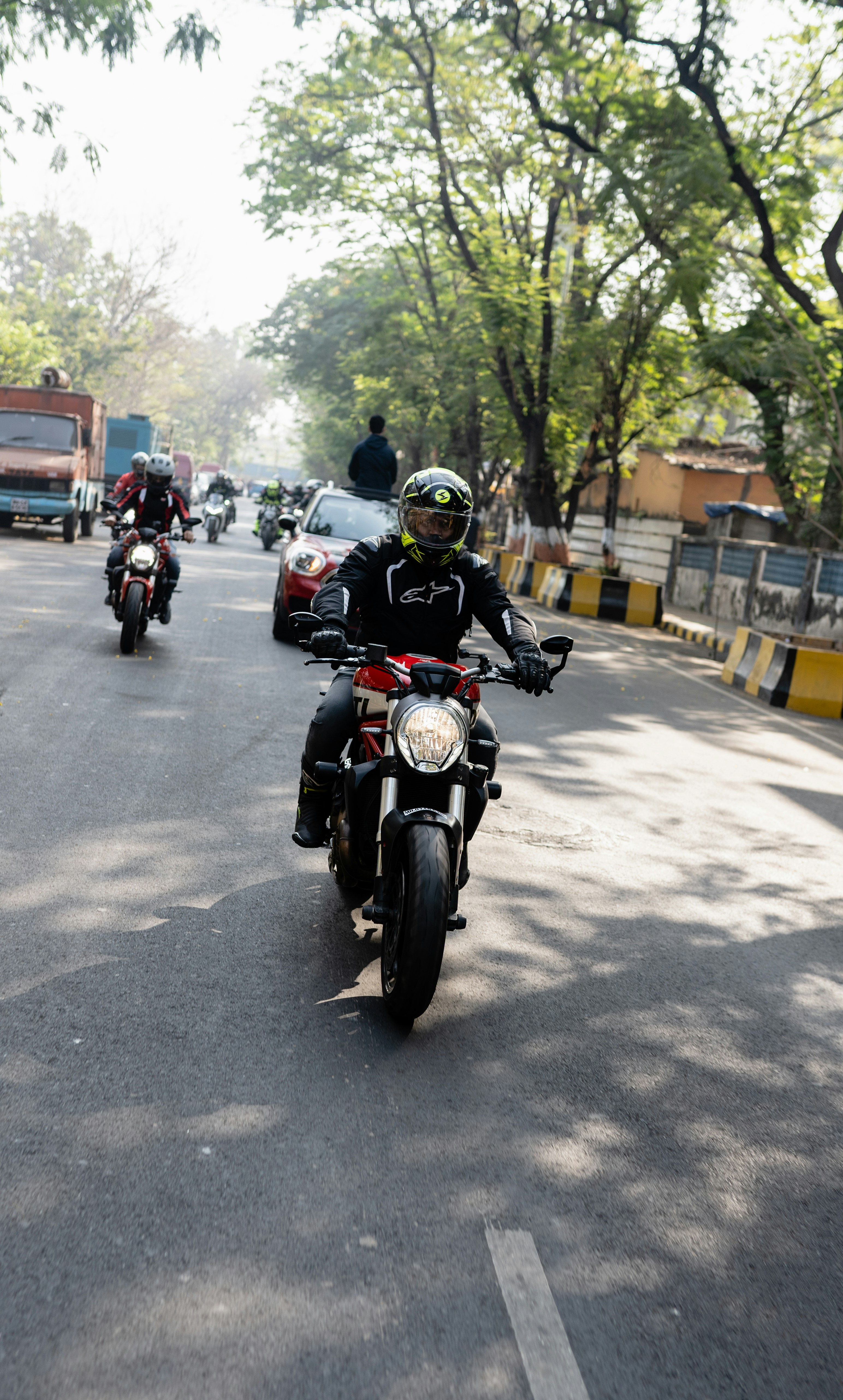 a group of people riding on the back of a motorcycle