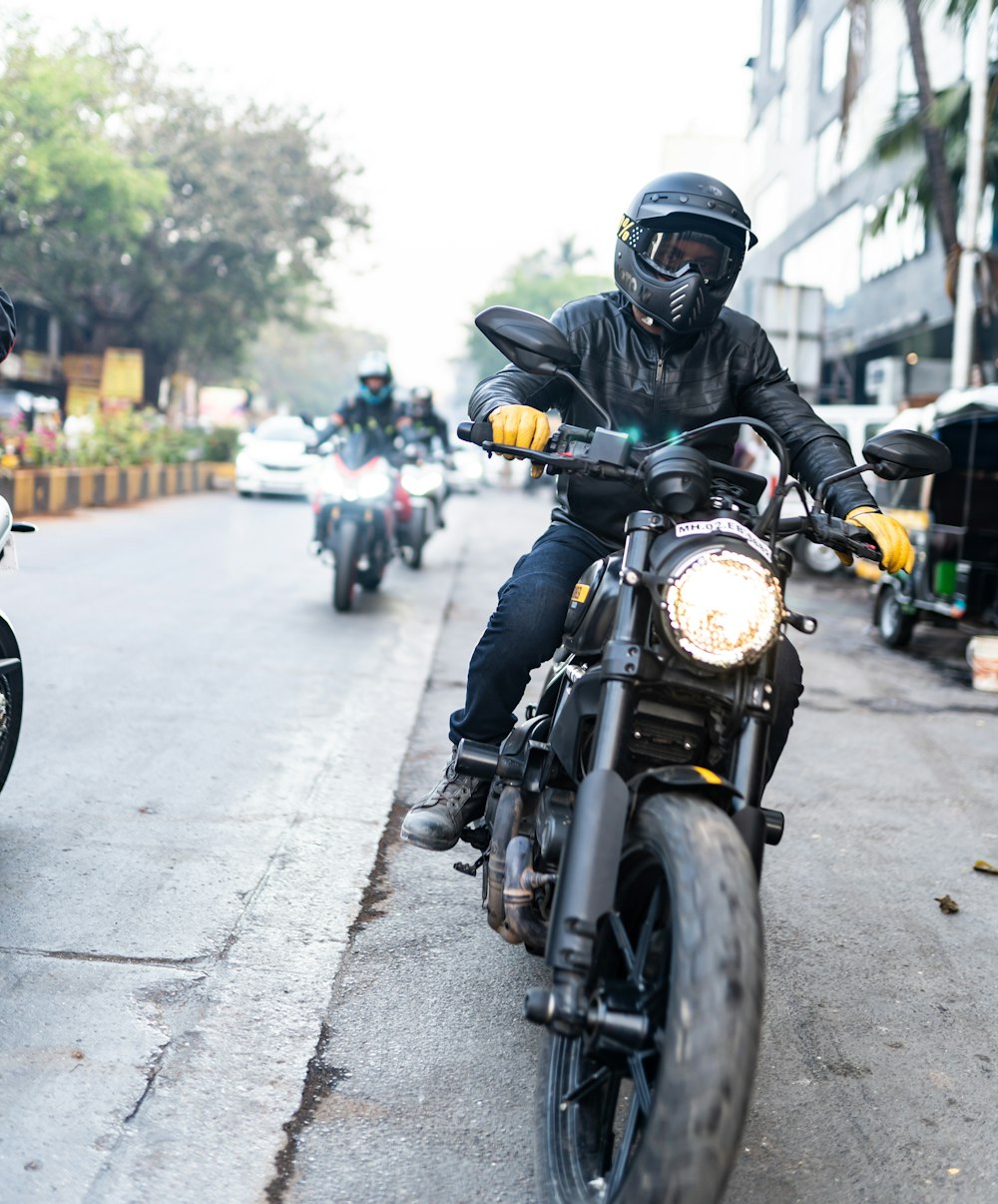 a person riding a motorcycle on a city street