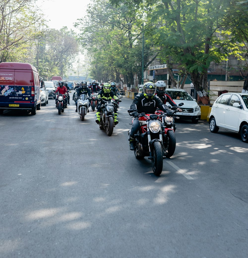 a group of people riding a motorcycle down a street