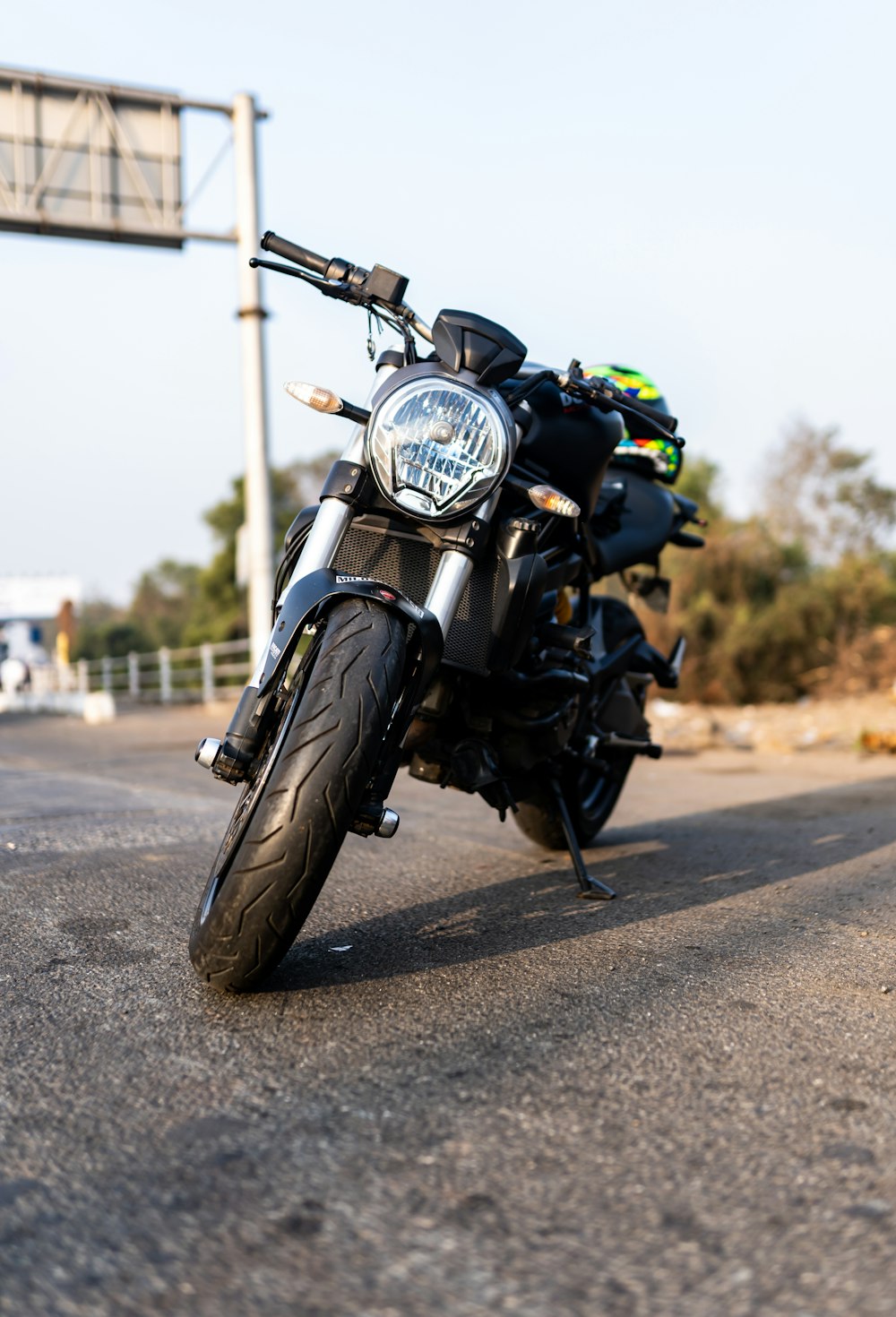 a person riding a motorcycle down a dirt road