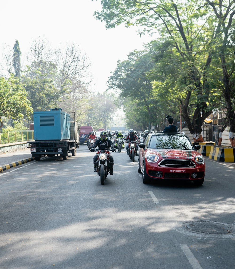 a group of police officers riding on the back of a truck