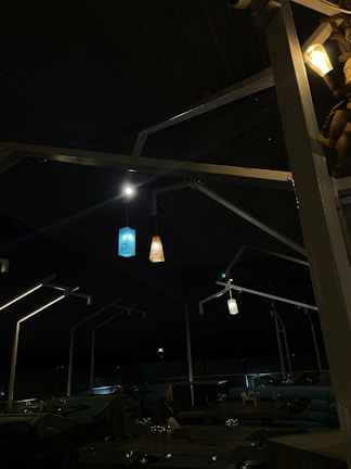 Outdoor seating area at sunset with Mediterranean style lighting and decor.