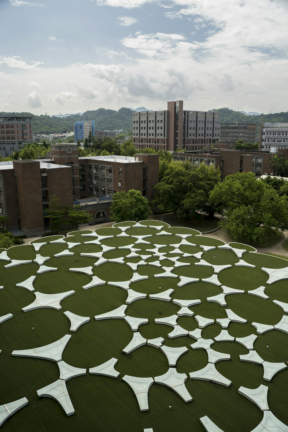 a building with a green roof with white circles on it