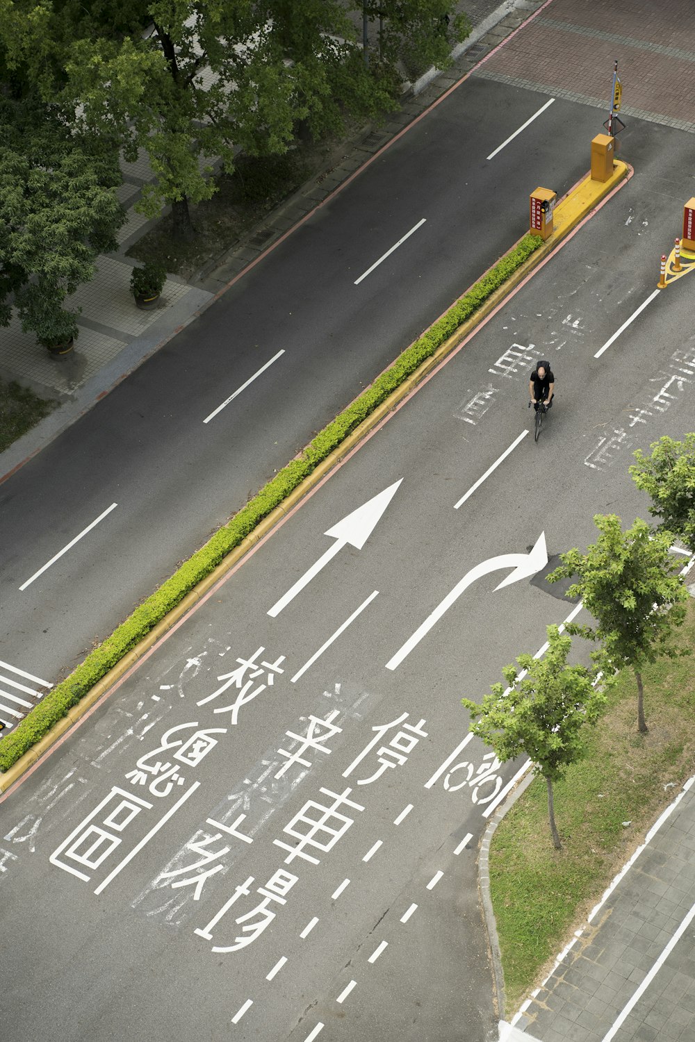 a person riding a bike down a street