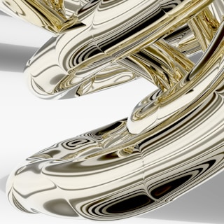 a close up of a metal object on a white surface