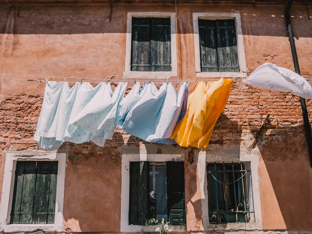 a building with a bunch of clothes hanging out to dry