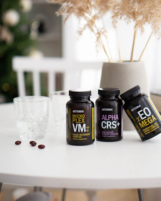 three bottles of vitamins sitting on a table