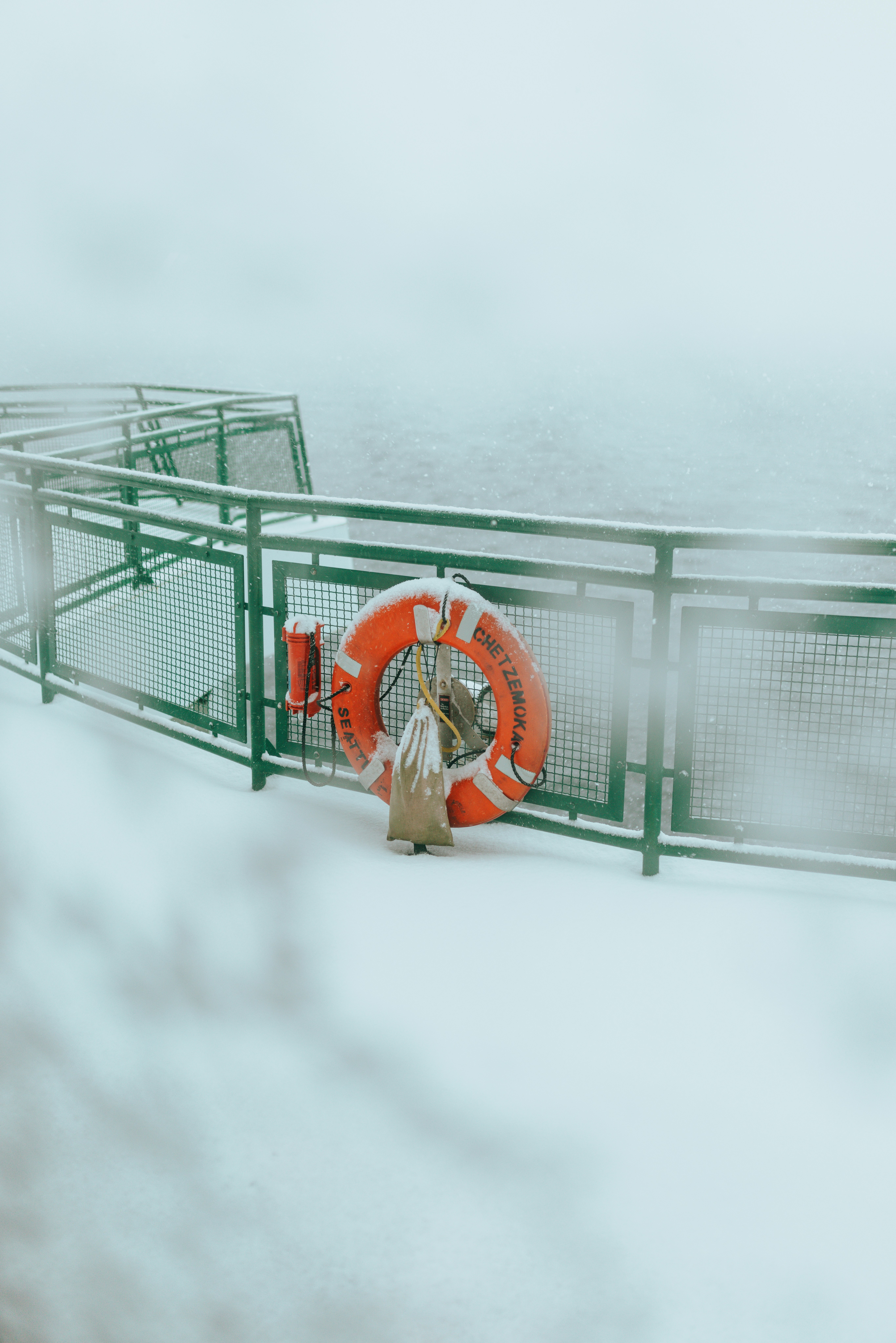 a life preserver on a boat in the snow