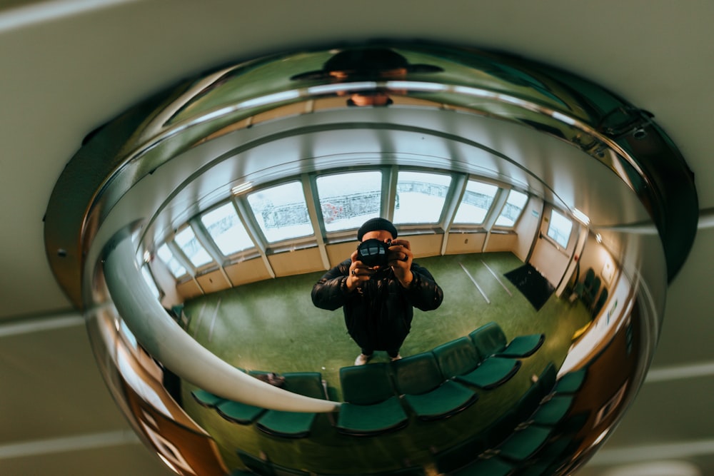 a man taking a picture of himself in a mirror