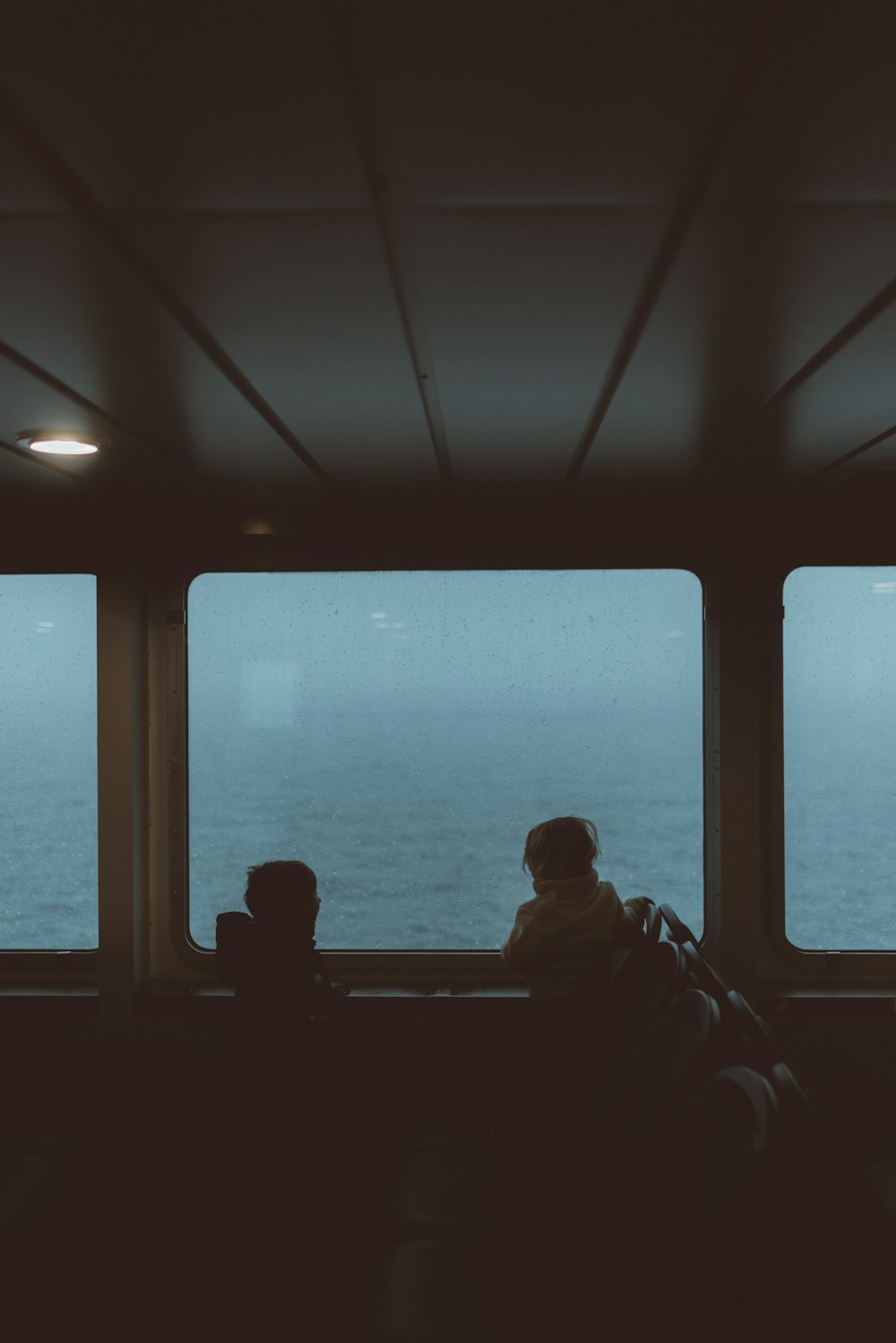 a couple of people sitting next to each other on a boat