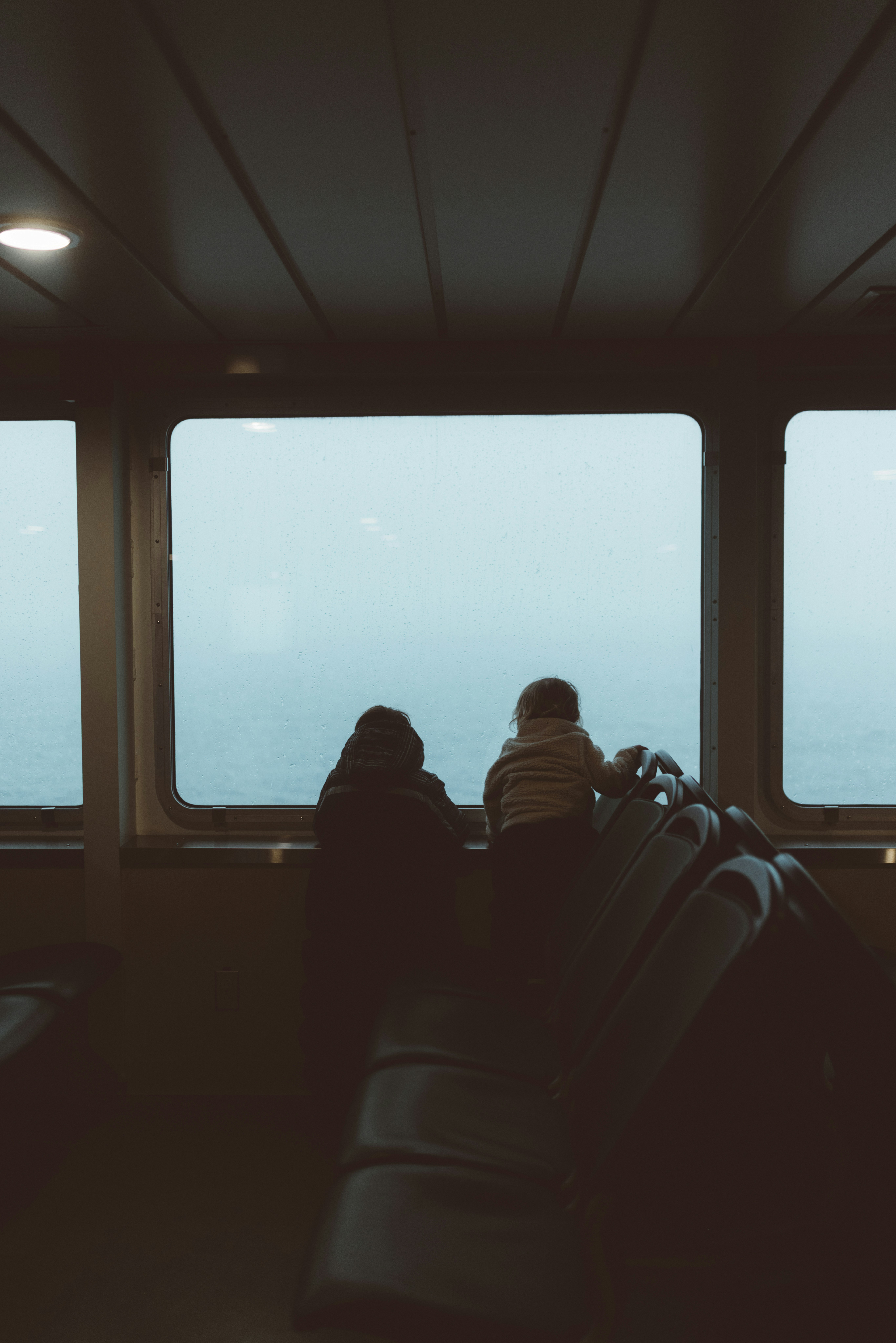 a couple of people sitting on top of a train