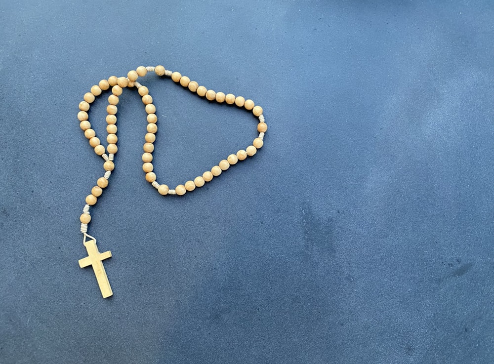 a rosary with a wooden cross on it
