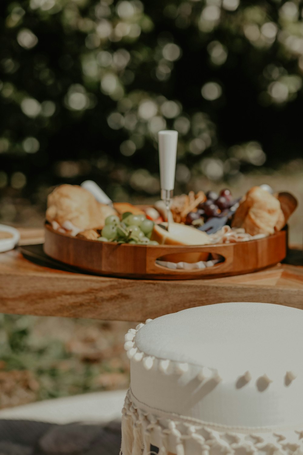 a wooden table topped with a plate of food