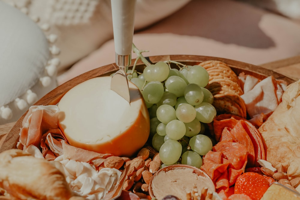 a close up of a plate of food with grapes