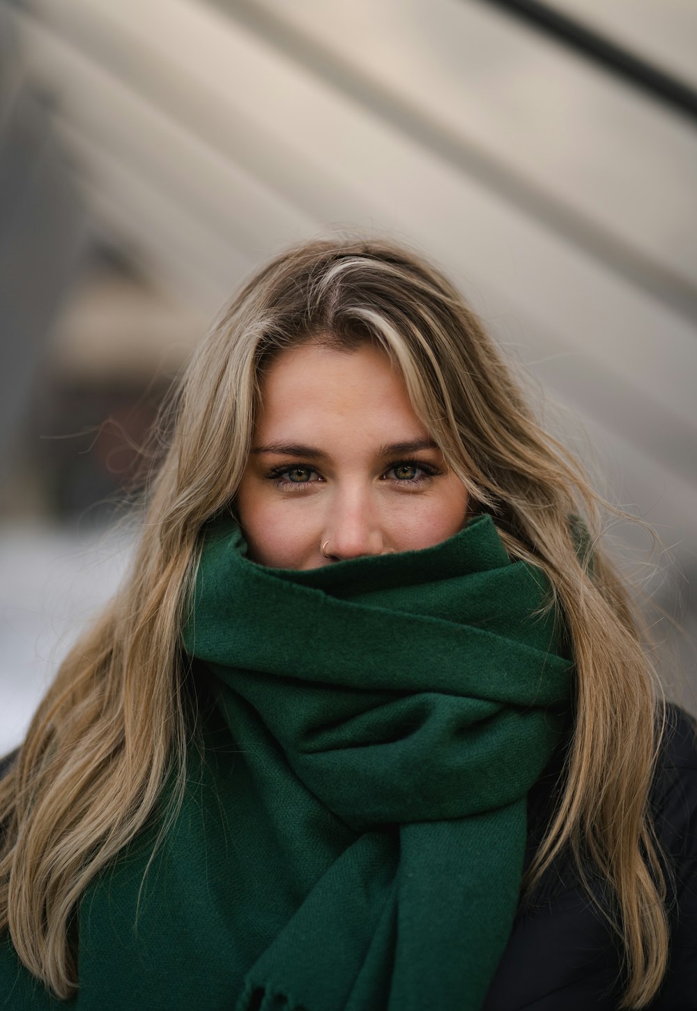 a woman with a green scarf around her neck