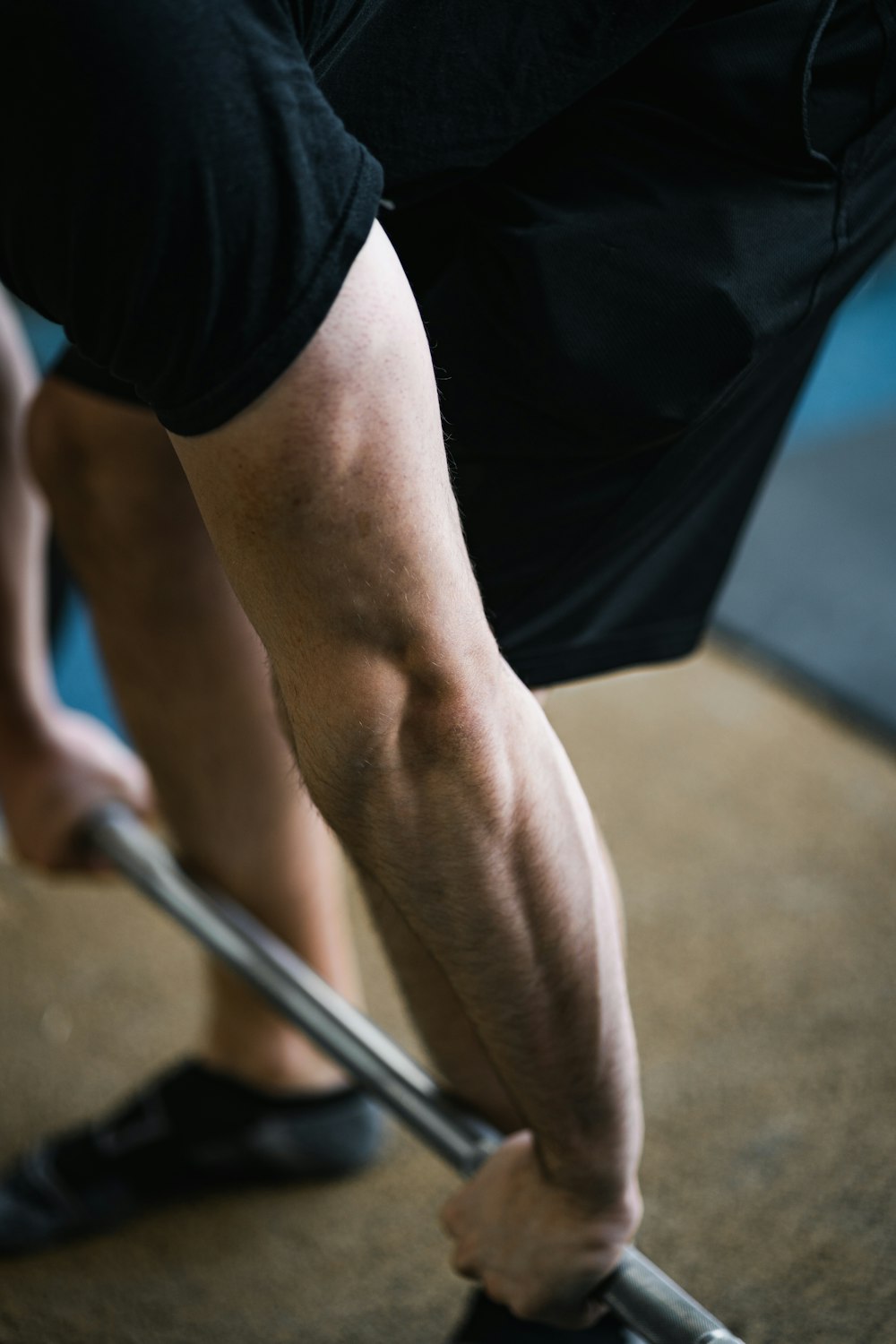 a close up of a person with a barbell