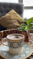 Close-up of a traditional Arabic coffee cup with intricate patterns on a wooden table.