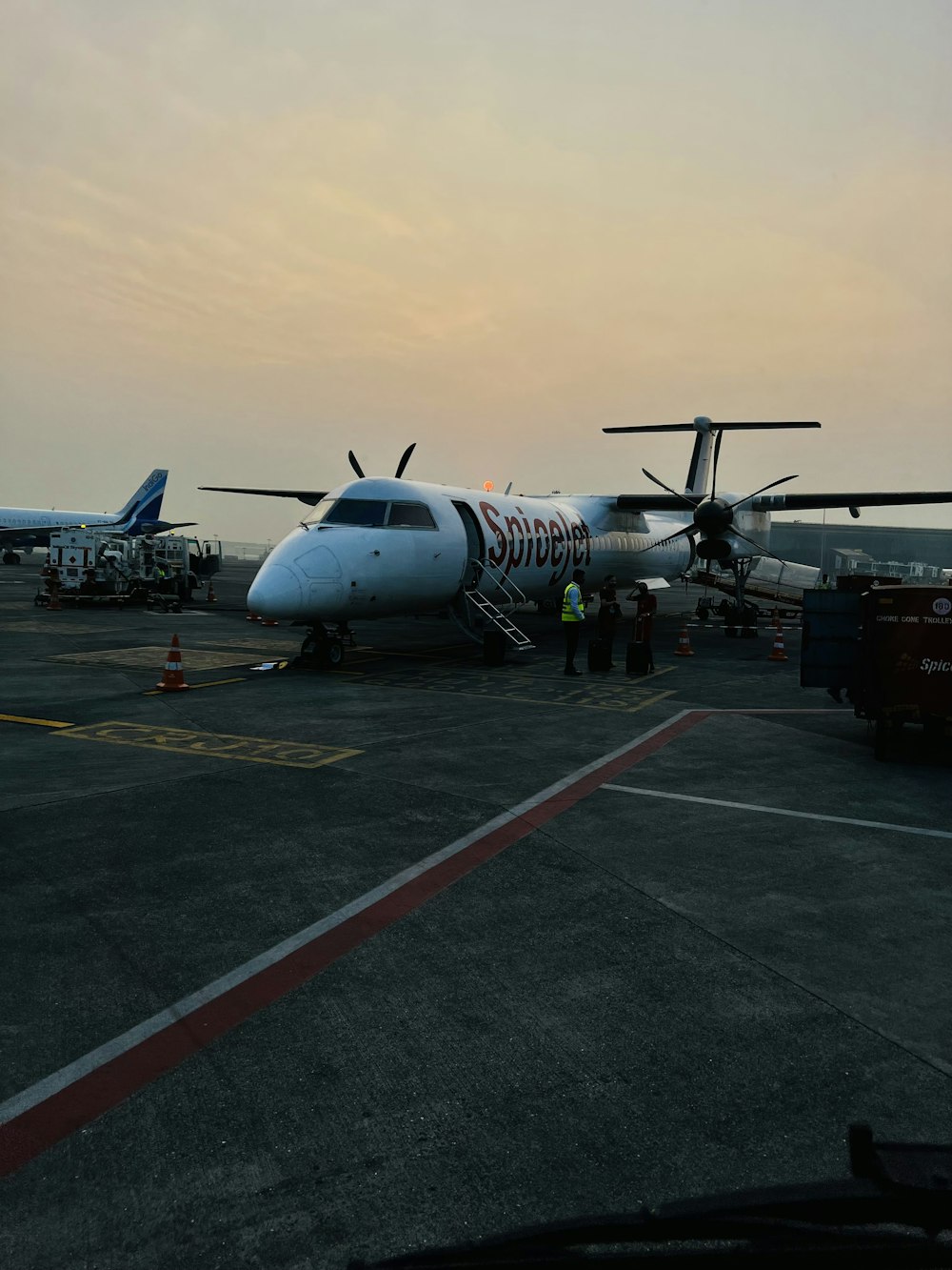 a large jetliner sitting on top of an airport tarmac