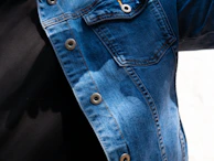 Denim jumpsuit worn by a factory worker, showing durability and comfortable fit.
