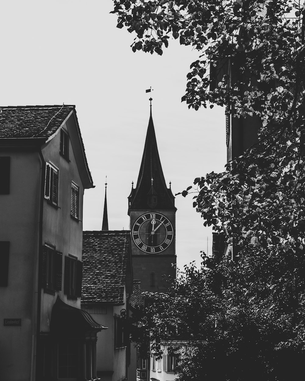 a black and white photo of a clock tower