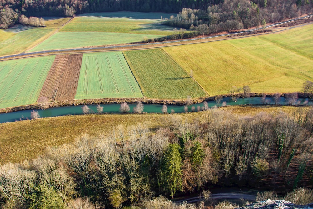 a river running through a lush green countryside