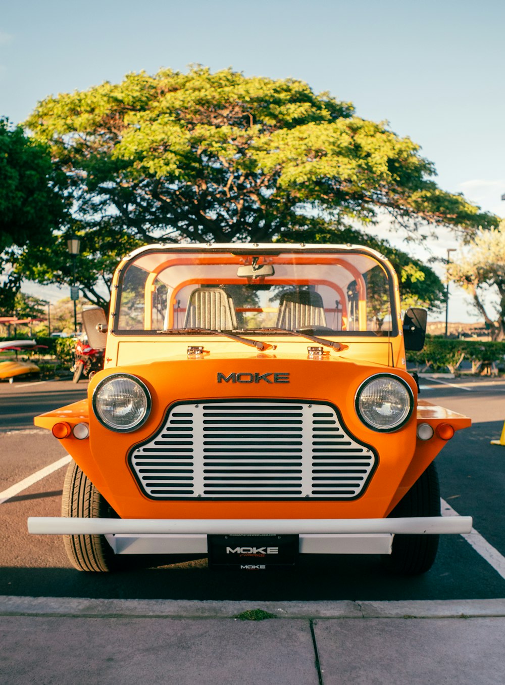 an orange truck parked in a parking lot