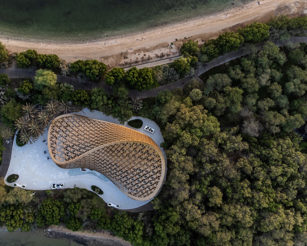 an aerial view of a building surrounded by trees