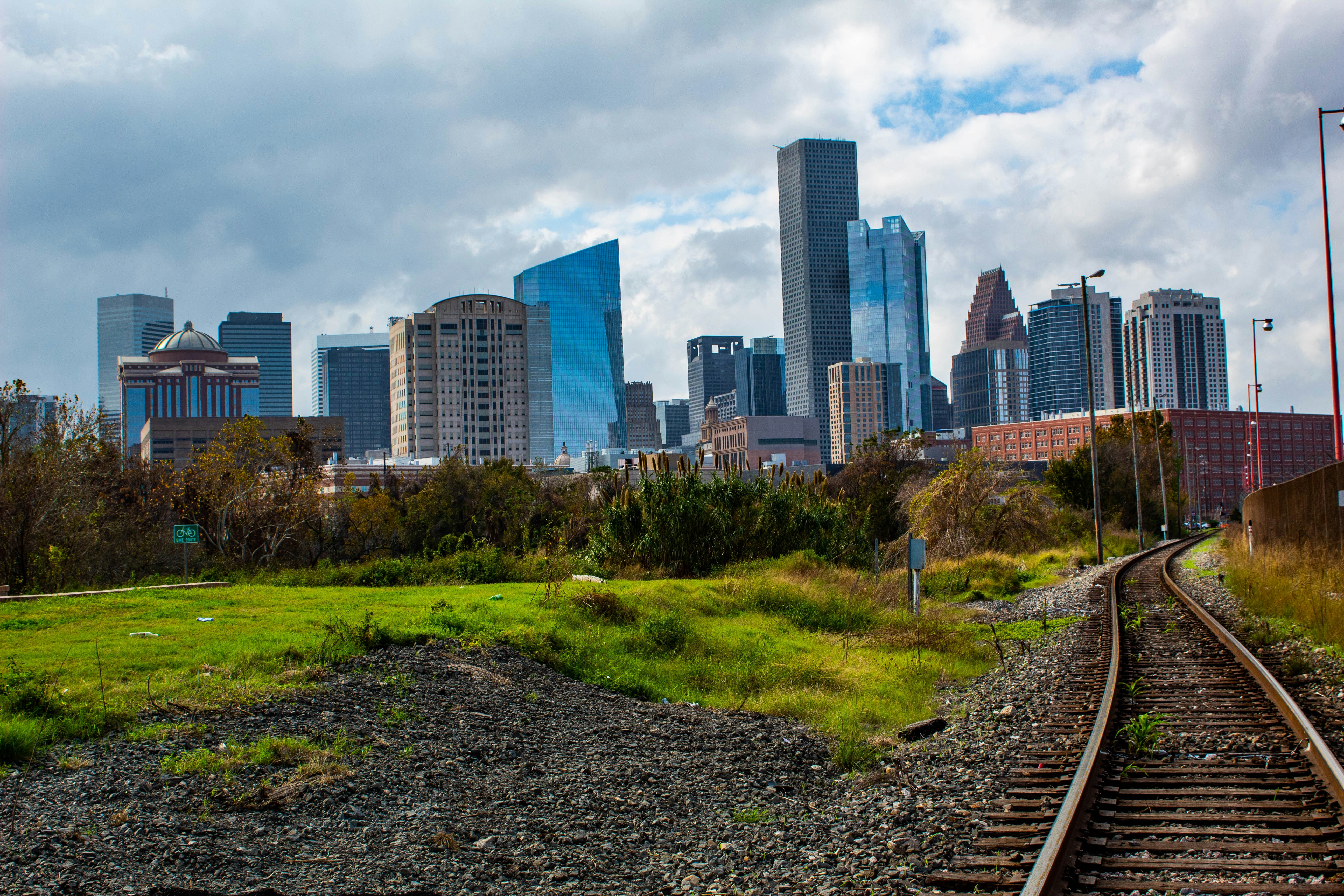 a train track with a city in the background