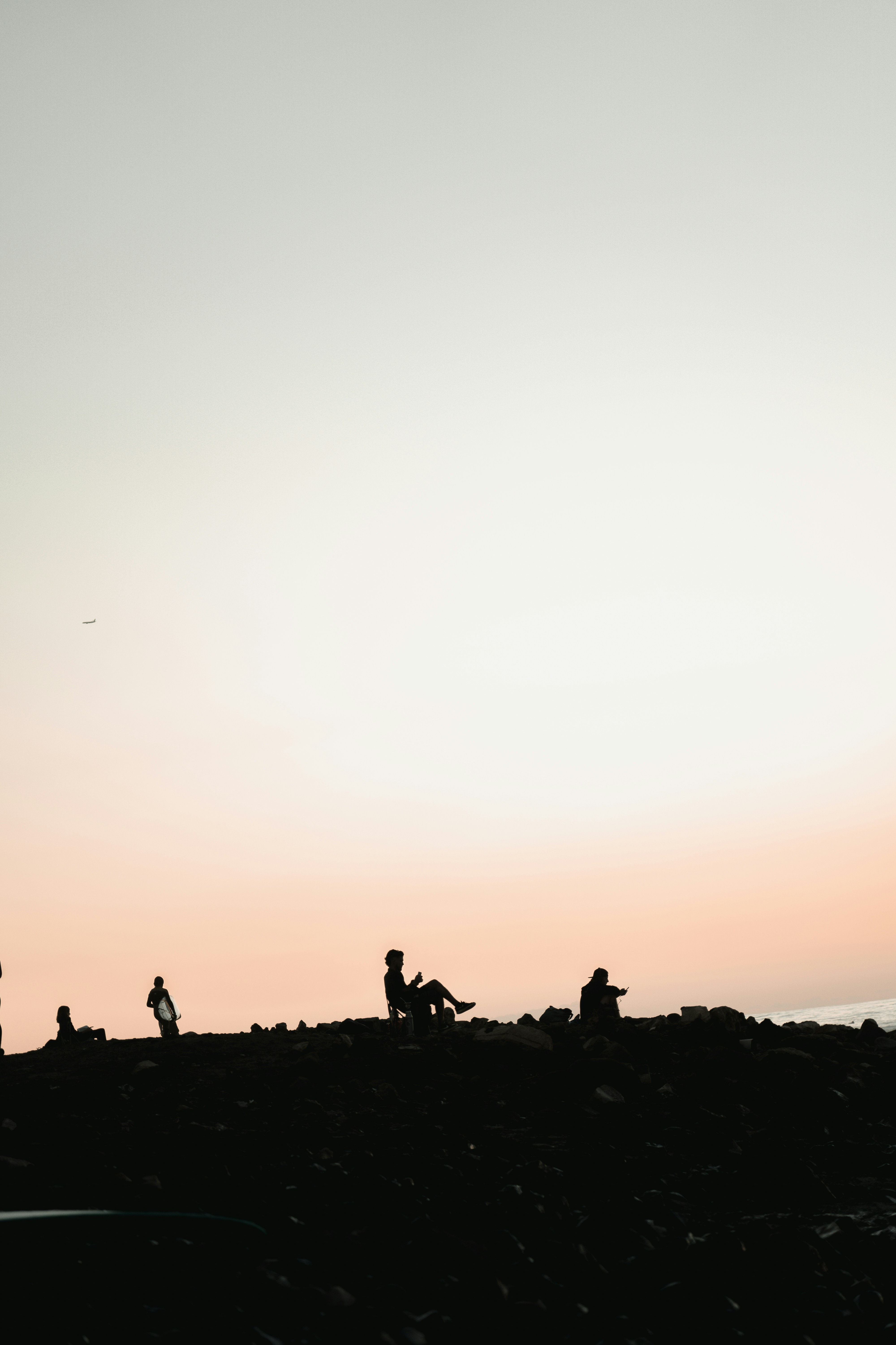 a group of people standing on top of a hill