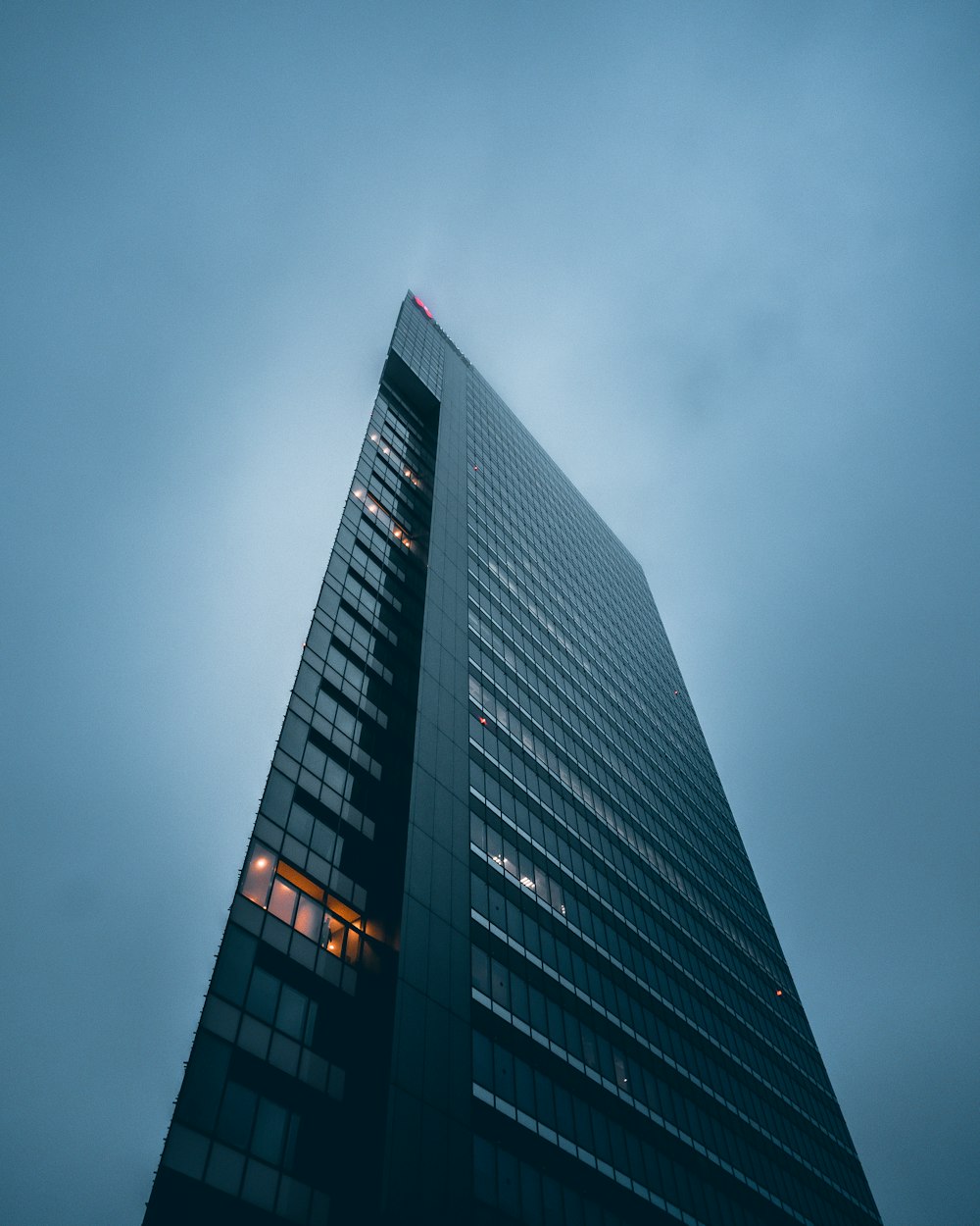 a very tall building with a sky background