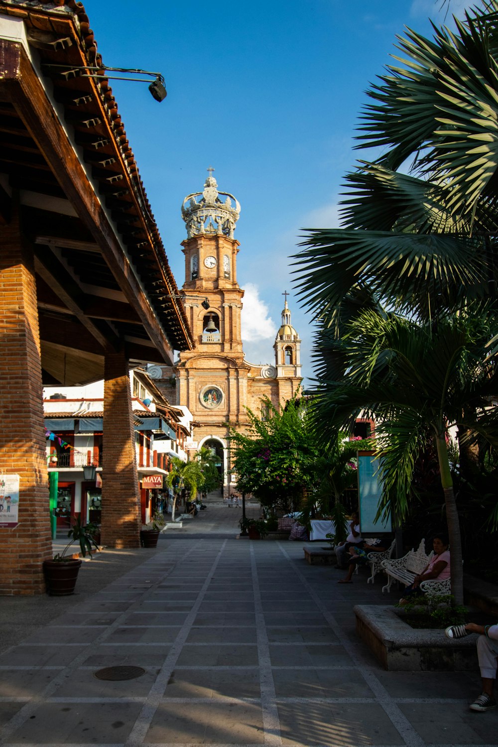 a large clock tower towering over a city street