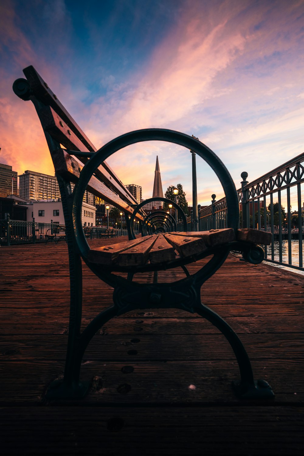 a bench sitting on top of a wooden pier