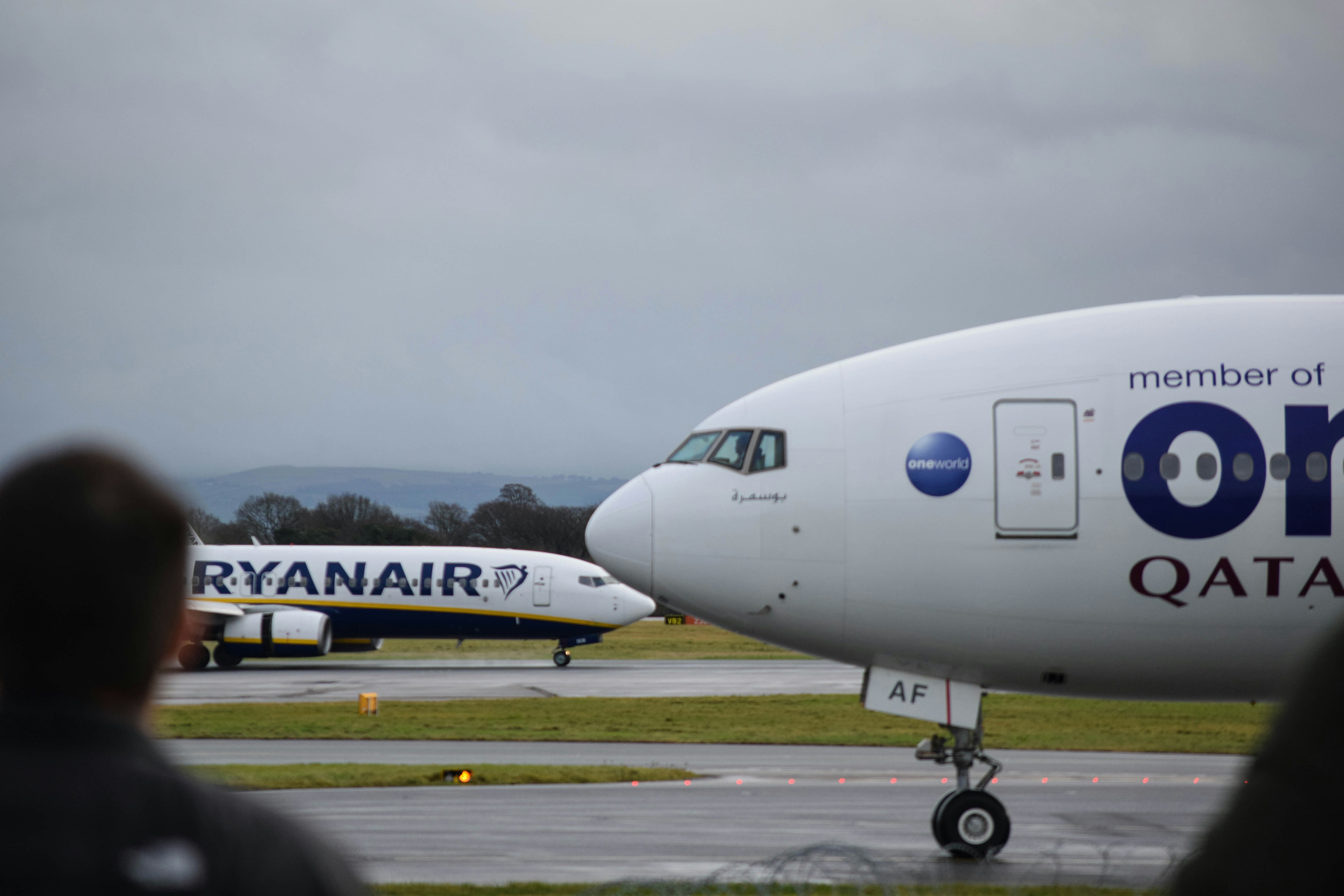 a large passenger jet sitting on top of an airport runway, 