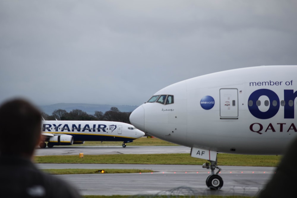 a large passenger jet sitting on top of an airport runway