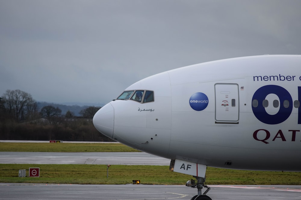 a large passenger jet sitting on top of an airport tarmac